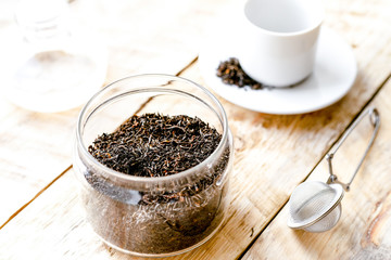Tea set on the wooden table at sunny morning