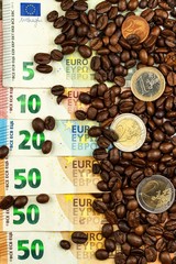 Roasted coffee beans and valid euro banknotes. Coffee trading. Sale of commodities.