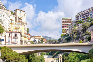 Daylight sunny view to Monaco city bridge, buildings and mountains in France