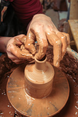 Potter at work. Workshop place.