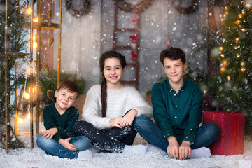 children at the photo shoot. snow. fun, Christmas trees. new Year