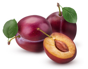 Two Fresh plum with leaf and one cut in half with bone