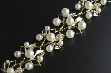 golden necklace with pearls isolated