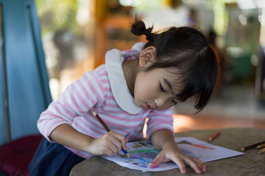 Asian Kids cute little girl drawing