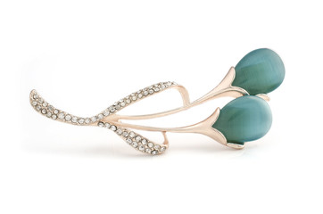 gold brooch flower with blue moon stone isolated on white