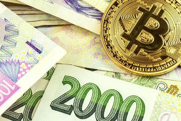 Valid Czech banknotes and Bitcoin. Risk investment. Virtual currency. Online trading.