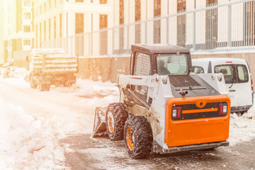 Machine remove snow from a city street