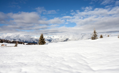 Fototapeta na wymiar snow mountains and blue sky in south tirol winter travel landscape