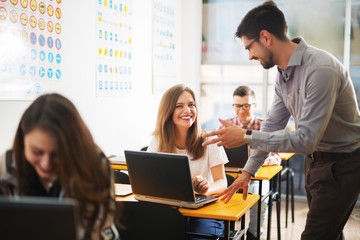 Young people in classroom laughing