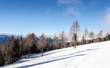 Fototapeta na wymiar snow mountains landscape and blue sky in south tirol winter travel
