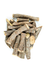 Pile of licorice roots isolated on a white background