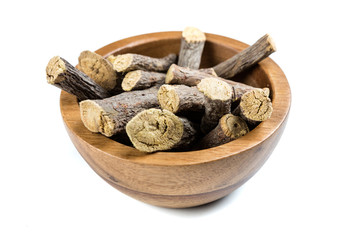 Pile of licorice roots isolated on a white background