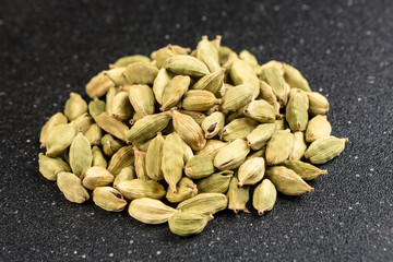 Pile of cardamom isolated on a black background
