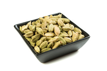 Pile of cardamom pods isolated on a white background