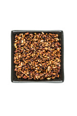 Pile of dried pomegranate seeds isolated on a white background