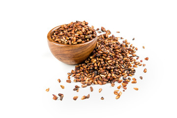 Pile of dried pomegranate seeds isolated on a white background