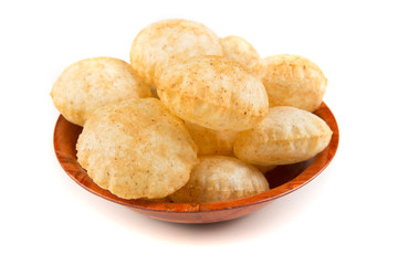 Puffed fried puri isolated on a white background isolated on a white background - obrazy, fototapety, plakaty