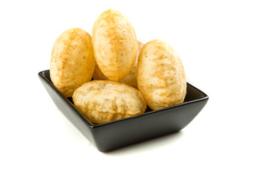 Puffed fried puri isolated on a white background isolated on a white background
