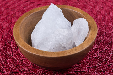 Crystallized alum chunks on a cloth background