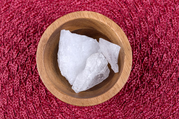 Crystallized alum chunks on a cloth background