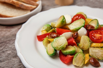 Plate of salad with Brussels sprouts on table