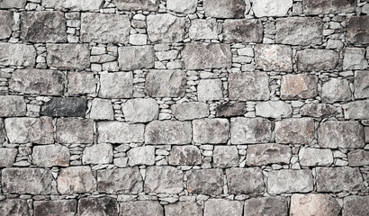Old gray stone wall, flat background photo