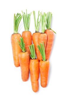 Tasty ripe carrots on white background