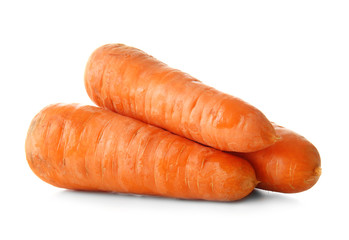 Tasty ripe carrots on white background