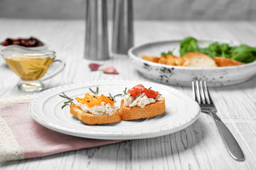 Tasty bruschettas with tomatoes on plate
