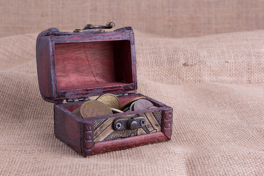 Wooden chest and old coins