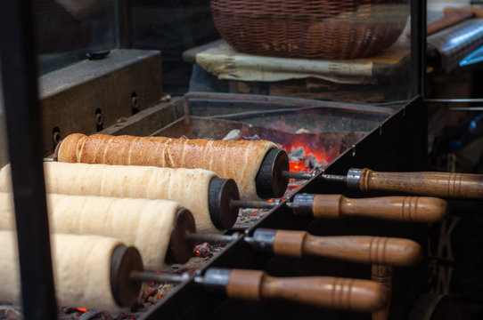 Chimney cake roasted over charcoal fired oven
