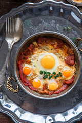 Top view of fried eggs with cured meat, turkish breakfast pastirmali yumurta