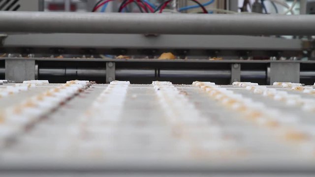 Ice cream factory. White plombir in a waffle cup. Ice cream in the shop at the ice cream factory. Vanilla ice cream.