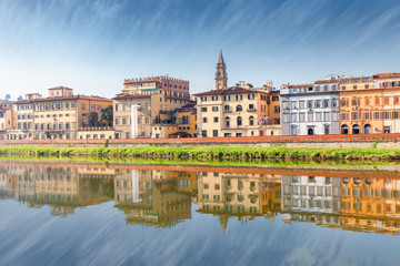 Fototapeta na wymiar Quay of the Arno River with reflection in Florence