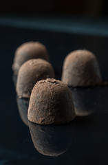 Homemade truffle chocolate candies with cocoa powder made by chocolatier
