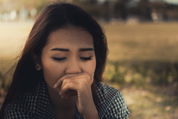 Close up asian sad woman heartbreak from From unrequited love,Brokenheart young girl concept,vintage style,dark tone