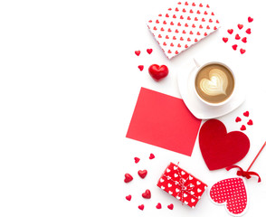 Valentines day greeting card. Coffee cup and gift box on wooden table. Top view with copy space