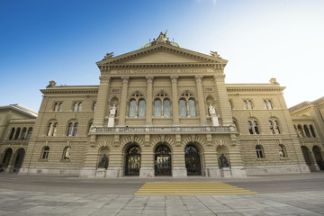 Fototapeta na wymiar Bern, Switzerland - October 30, 2017: The Federal Palace, which is the seat of Federal Parliament (Swiss Federal Assembly), is located in a large building which dominates this part of the city.