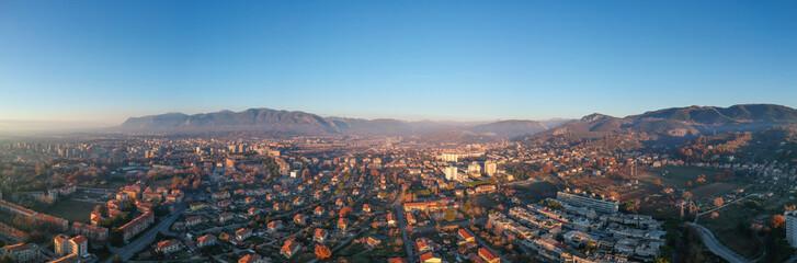 Fototapeta na wymiar Panorama of Terni, Umbria, Italy. Christmas day, smoke over city, sunset light. Shutted from the drone, 120 m.