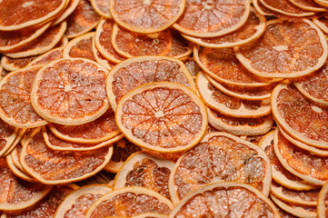 Pile of dried orange citrus circles and candied fruits