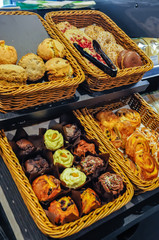 Scones, donuts, muffins and danish pastries on sale at a motorway service station