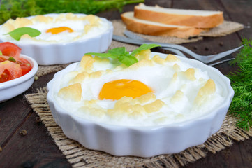 Delicate baked egg Orsini (eggs in the cloud). French breakfast.
