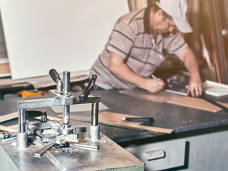 The joiner marks the workpiece for the wooden product.