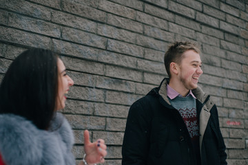 two friends with a good mood joking while walking in the yard