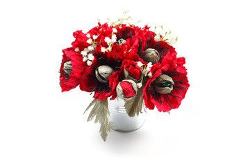 Bouquet of paper poppies handmade with candies in a galvanized metal bucket as a gift
