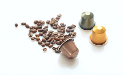 Espresso coffee pods and coffee beans on white background, Closeup view with details