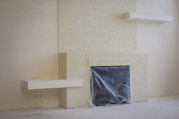 Indoor diy project building fireplace in the house finishing touches selective focus 