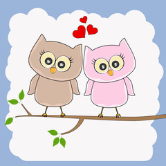 Two loving owls, happy birds are sitting on a tree.