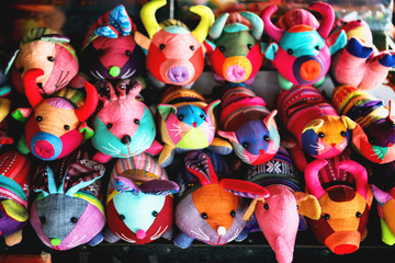 beautiful and colourful silk and cotton Indian craft toys of animals handmade sold in souvenir shop market stall