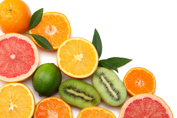 healthy food. mix sliced lemon, green lime, orange, mandarin, kiwi fruit and grapefruit with green leaf isolated on white background. top view with copy space